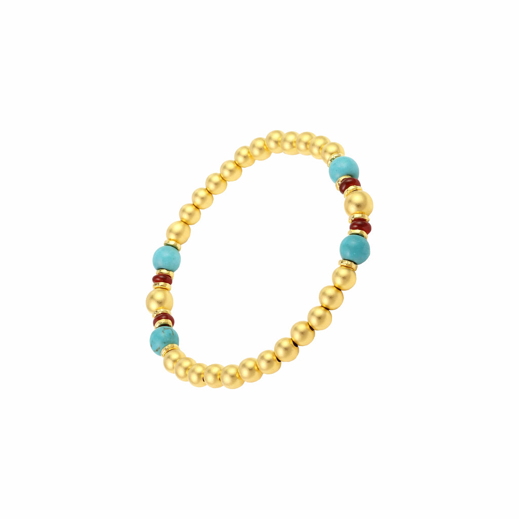 [Brand] 24K Gold Plated Turquoise Bead Bracelet worn on wrist, elegant lifestyle shot.