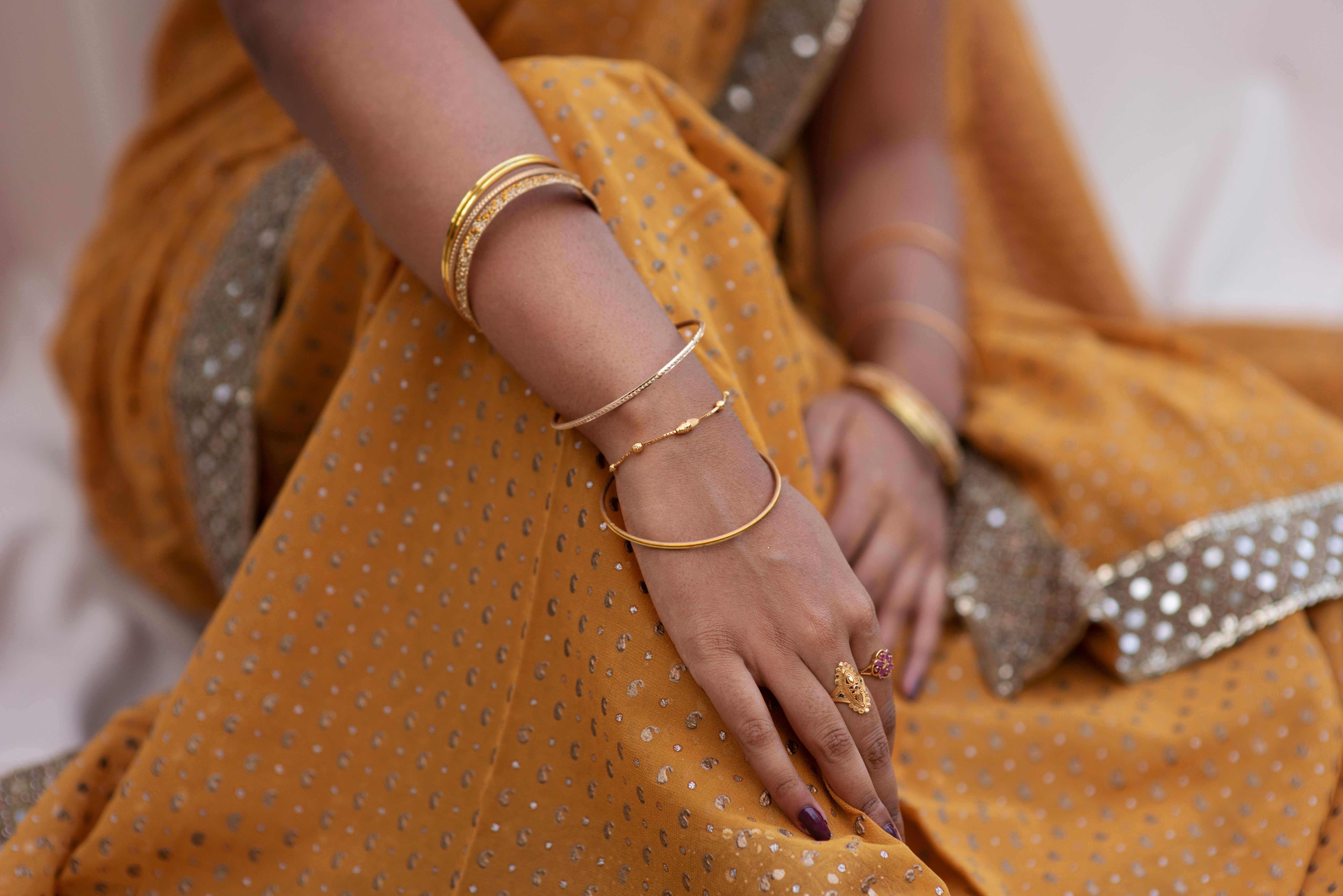 jewel-details-hands-woman-wearing-sari-dress.jpg__PID:30f21029-3add-4fc0-965d-ae266a0c7047